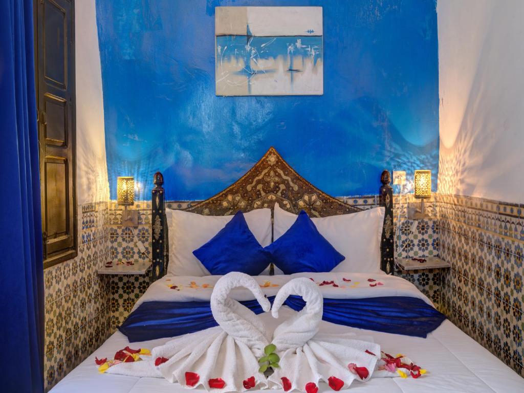 Postel nebo postele na pokoji v ubytování Riad Lazorde De Marrakech