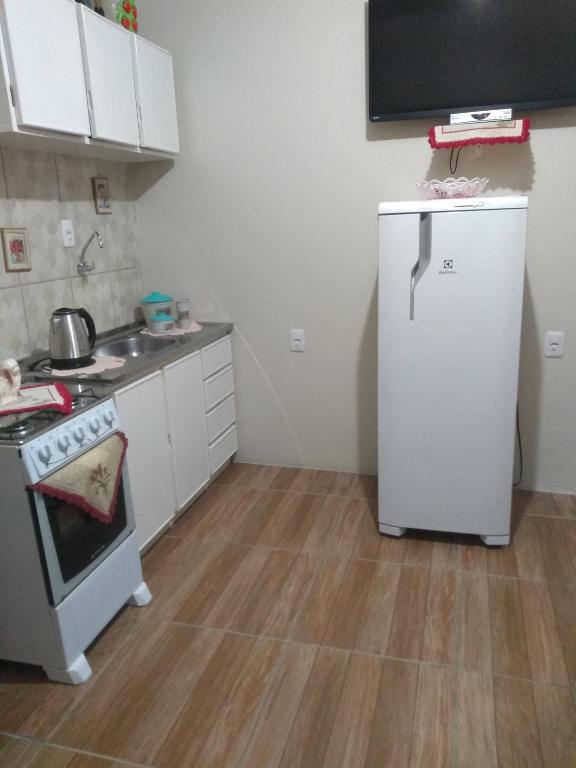 Kuchyň nebo kuchyňský kout v ubytování Casa e Flat Conforto Gramado
