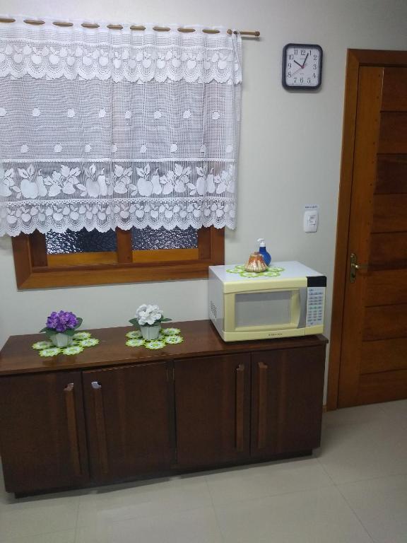 Kuchyň nebo kuchyňský kout v ubytování Casa e Flat Conforto Gramado