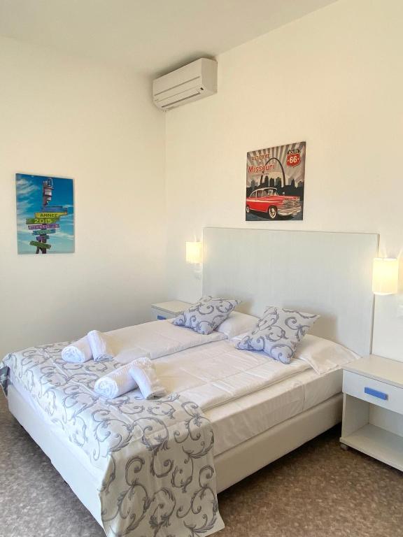 Postel nebo postele na pokoji v ubytování Hotel Linda