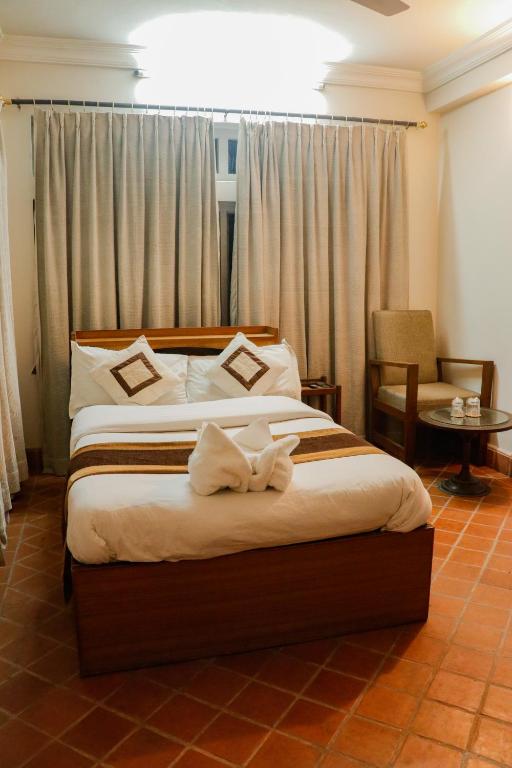 Postel nebo postele na pokoji v ubytování Hotel ThorongLa Thamel