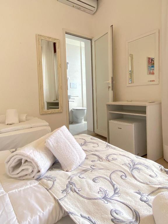 Postel nebo postele na pokoji v ubytování Hotel Linda