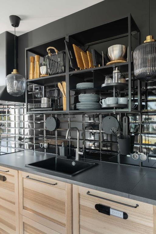 Kuchyň nebo kuchyňský kout v ubytování WILLA MAGNOLIA - Apartamenty i Pokoje - ROWERY, POKÓJ ZABAW, KAWA Z EKSPRESU