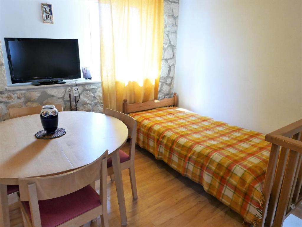 Postel nebo postele na pokoji v ubytování Το Λαϊνάκι by Fox Tale Guest House