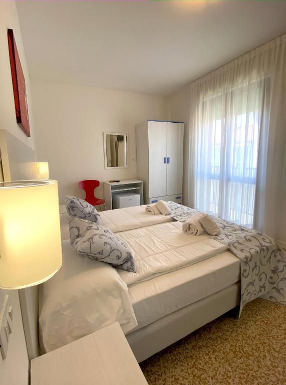Postel nebo postele na pokoji v ubytování Hotel Linda