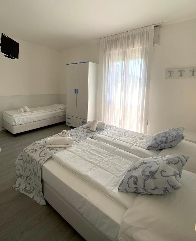 Postel nebo postele na pokoji v ubytování Hotel Linda