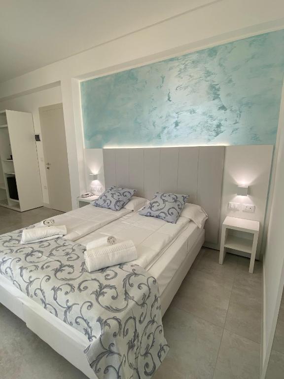 Postel nebo postele na pokoji v ubytování Hotel Linda
