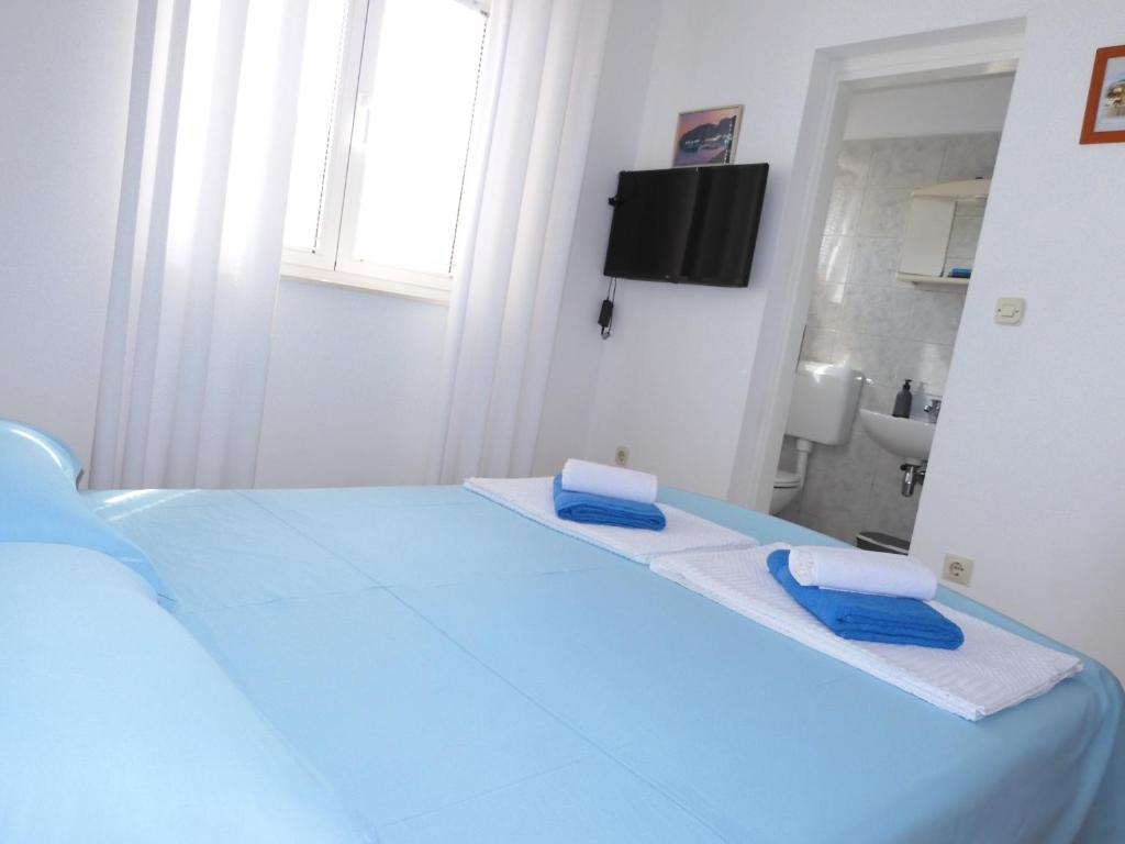 Posteľ alebo postele v izbe v ubytovaní Jagoda Apartman