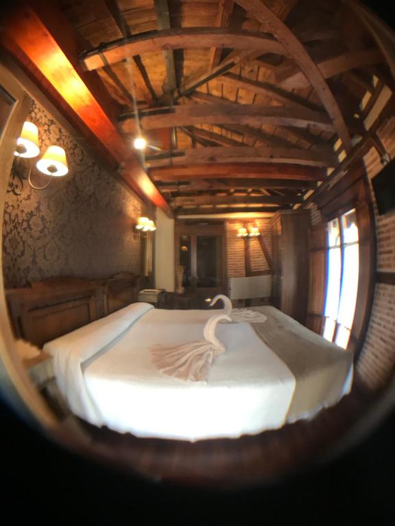 Postel nebo postele na pokoji v ubytování Hospederia Casa de Cisneros
