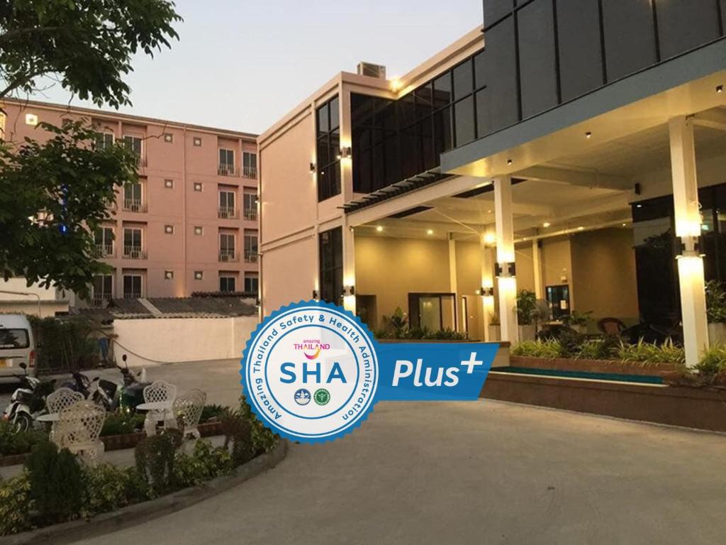 a sign that says shha plus in front of a building at Pongsakorn Boutique Resort -SHA Extra Plus in Lat Krabang