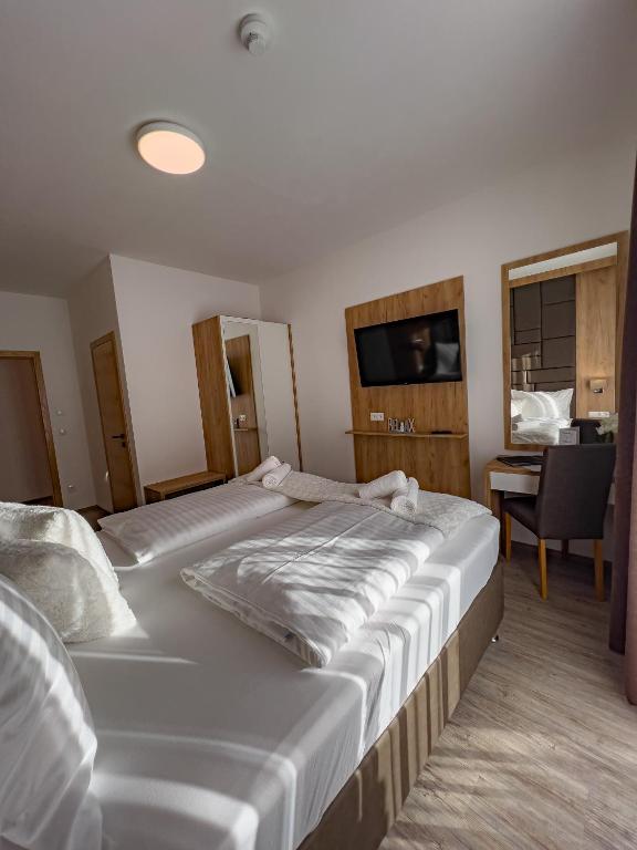 Postel nebo postele na pokoji v ubytování Sylpaulerhof Aparthotel