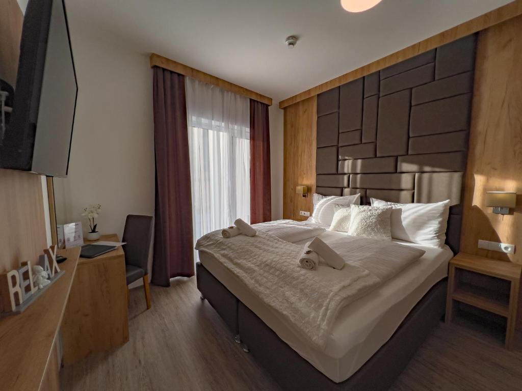 Postel nebo postele na pokoji v ubytování Sylpaulerhof Aparthotel