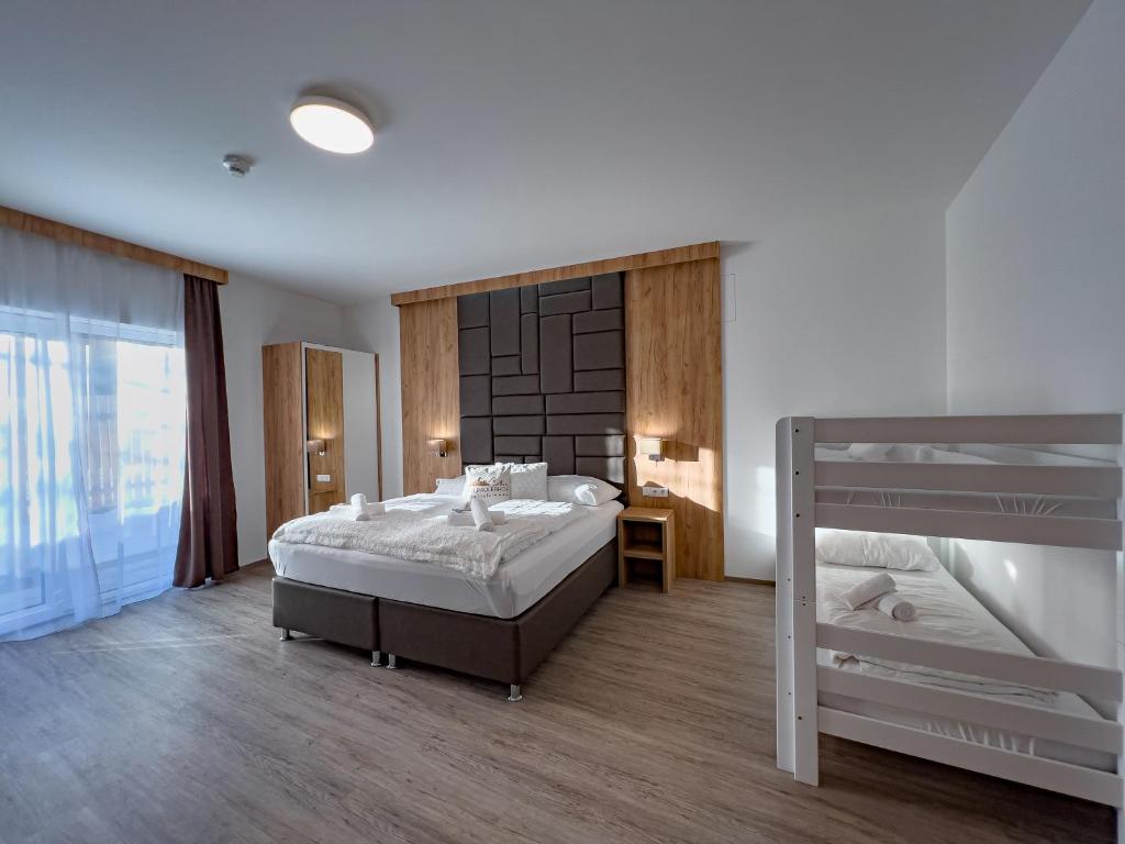 Postel nebo postele na pokoji v ubytování Sylpaulerhof Aparthotel