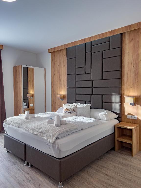 Postel nebo postele na pokoji v ubytování Sylpaulerhof Aparthotel