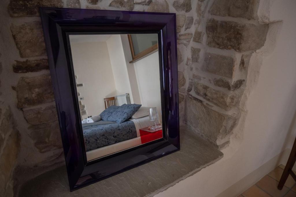 Postel nebo postele na pokoji v ubytování Ercole
