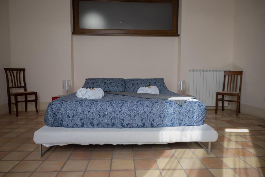 Postel nebo postele na pokoji v ubytování Ercole