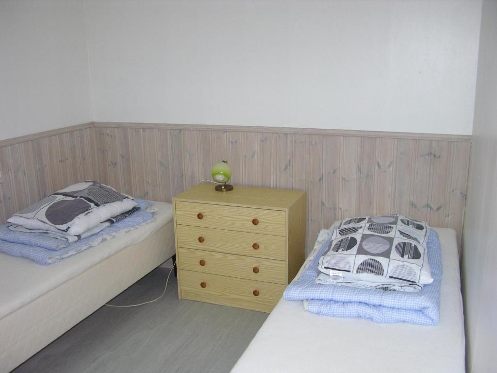 Krevet ili kreveti u jedinici u objektu Nydelig leilighet i første etage.