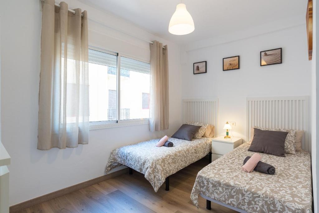A bed or beds in a room at Soho Centro Terrace 2 Rooms Young People Only