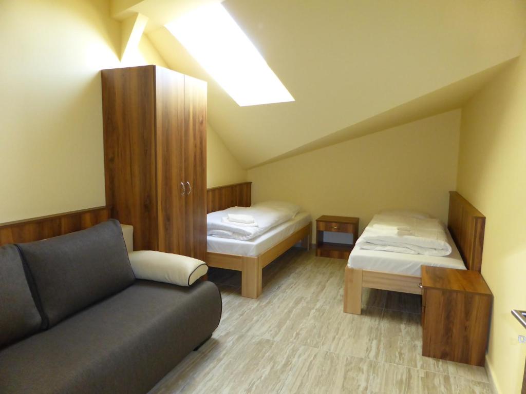 Posteľ alebo postele v izbe v ubytovaní Sástó Hotel