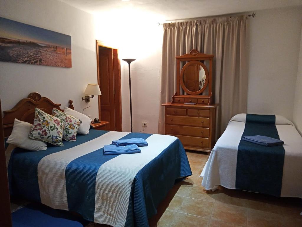 A bed or beds in a room at El Cercado