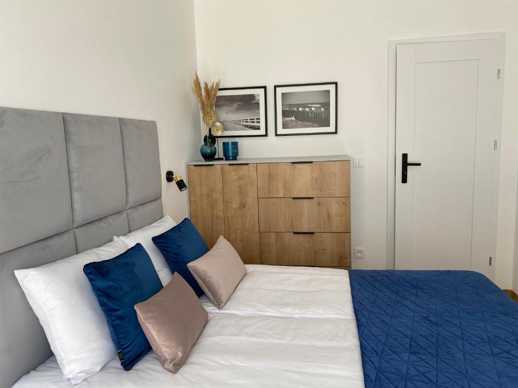Łóżko lub łóżka w pokoju w obiekcie P&A APARTAMENT