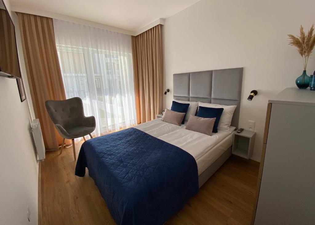 Łóżko lub łóżka w pokoju w obiekcie P&A APARTAMENT