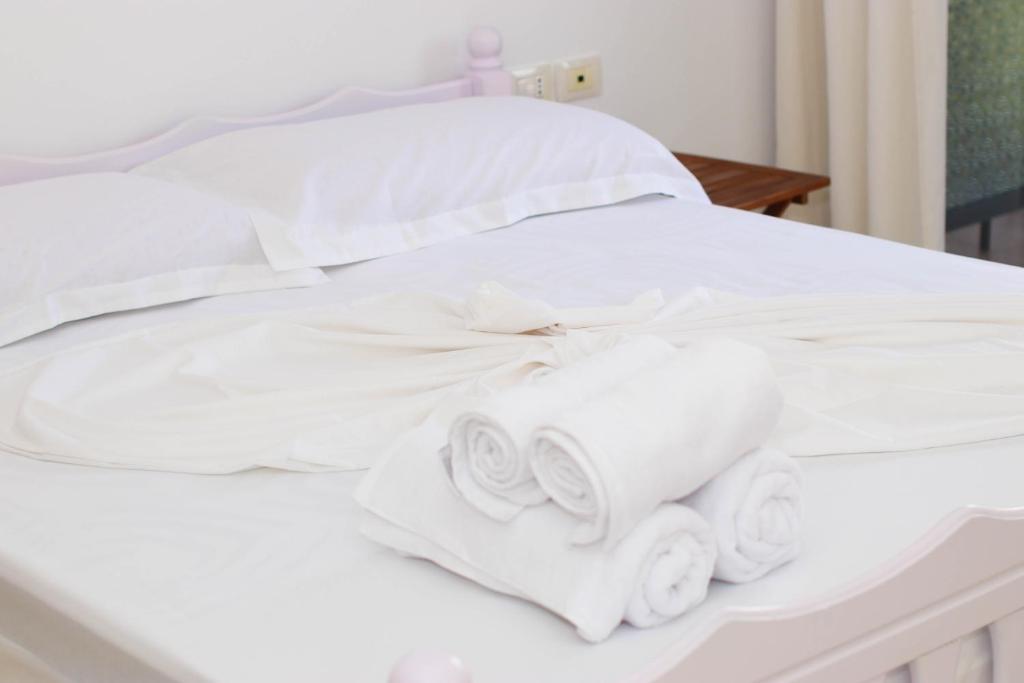 Postel nebo postele na pokoji v ubytování Bora Rooms