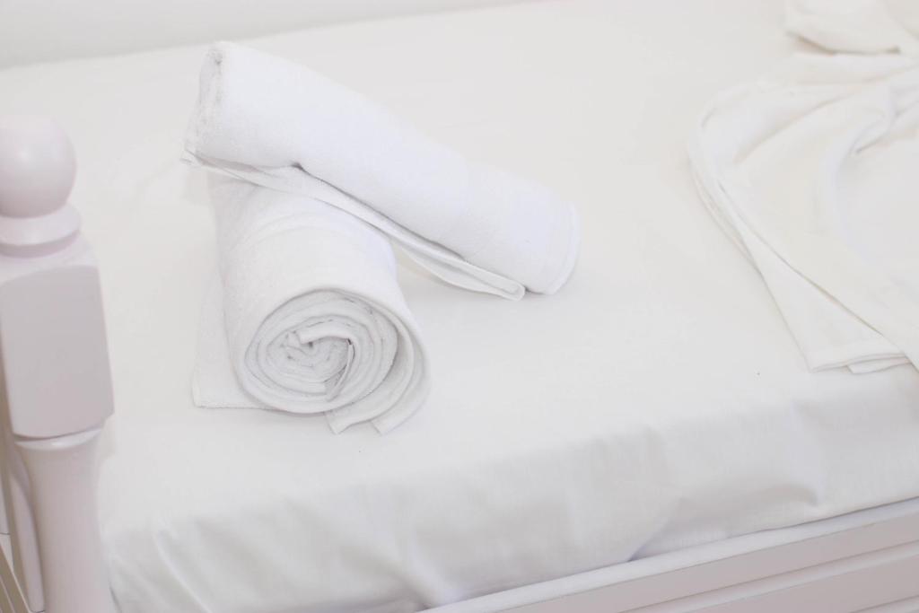 Postel nebo postele na pokoji v ubytování Bora Rooms