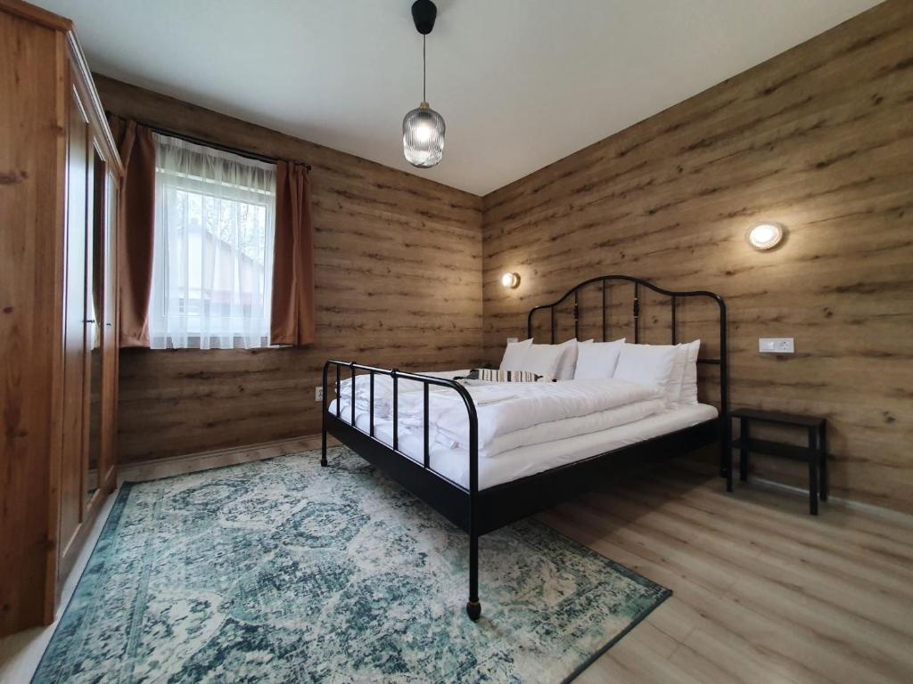 Postel nebo postele na pokoji v ubytování Harmónia faházak