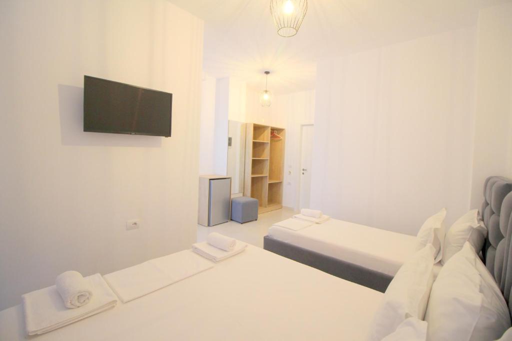 Postel nebo postele na pokoji v ubytování J&B Hotel