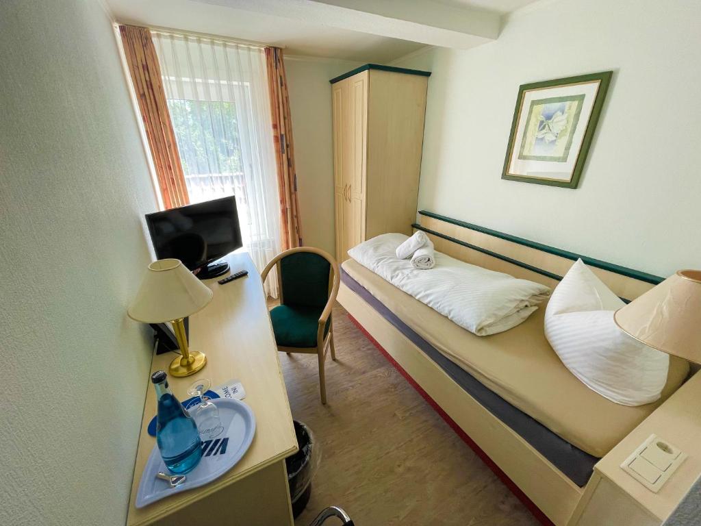 Postel nebo postele na pokoji v ubytování Hotel Schnehagen