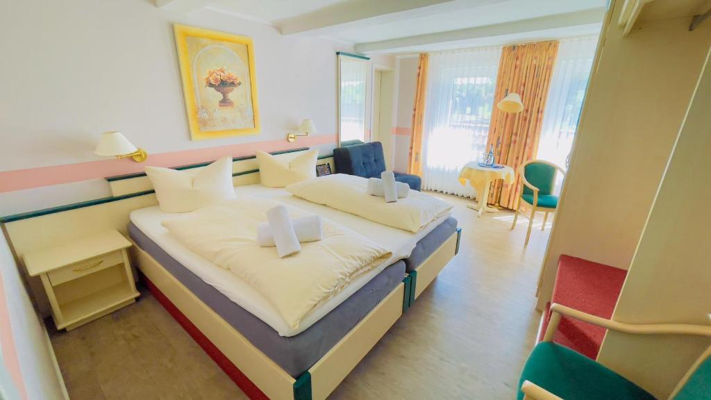 Postel nebo postele na pokoji v ubytování Hotel Schnehagen
