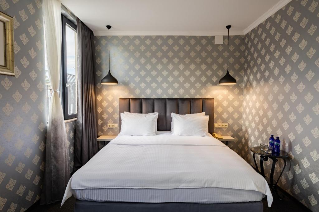 Postel nebo postele na pokoji v ubytování Hotel Day Inn