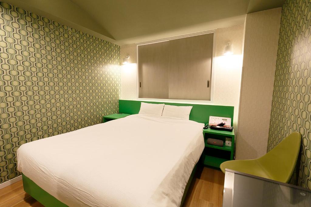 Postel nebo postele na pokoji v ubytování 555MOTEL SHONAN