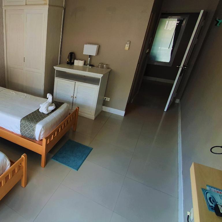 Postel nebo postele na pokoji v ubytování Lenny's Koh Samui
