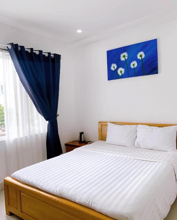 Postel nebo postele na pokoji v ubytování Cavilla Boutique Hotel & Apartment Da Nang