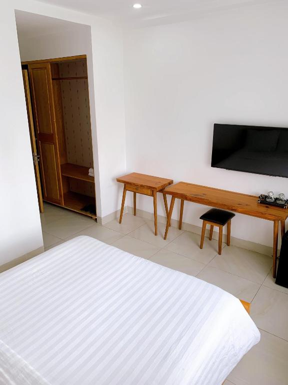 TV a/nebo společenská místnost v ubytování Cavilla Boutique Hotel & Apartment Da Nang