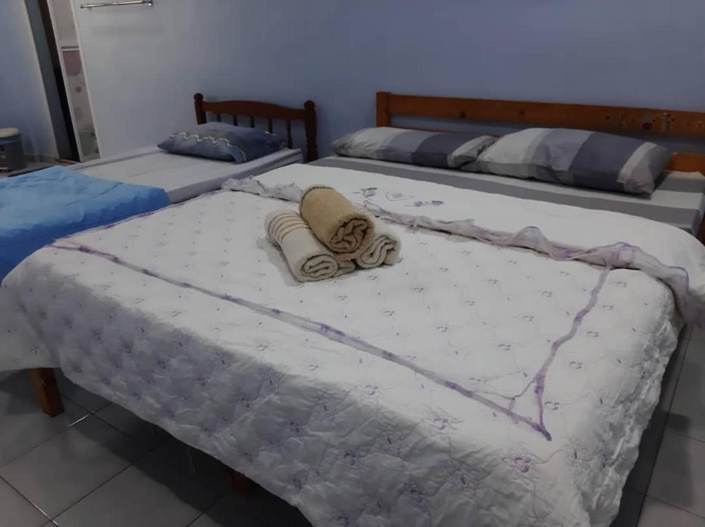Postel nebo postele na pokoji v ubytování BerataStay @ Segamat