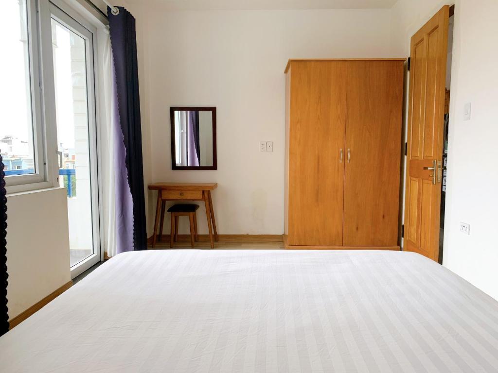 Postel nebo postele na pokoji v ubytování Cavilla Boutique Hotel & Apartment Da Nang