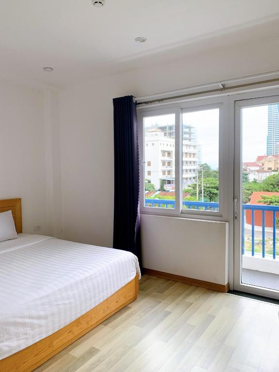 Postel nebo postele na pokoji v ubytování Cavilla Boutique Hotel & Apartment Da Nang