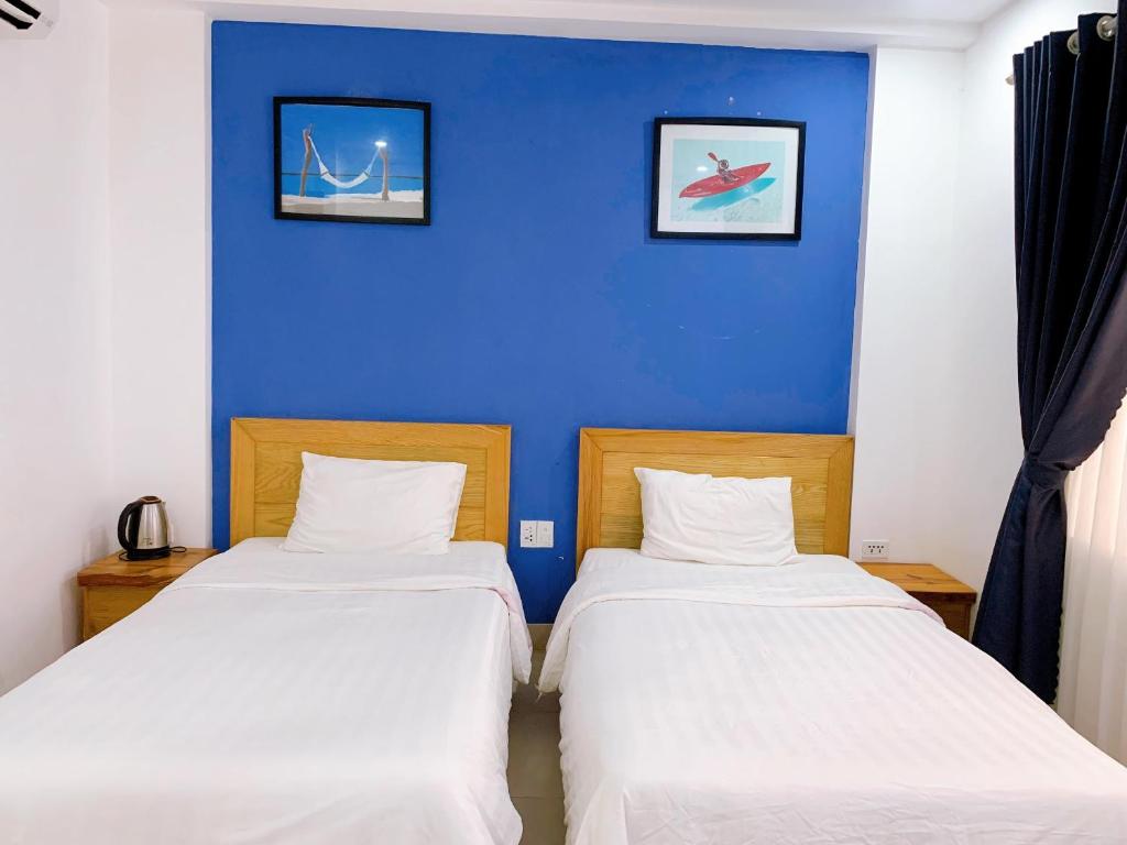 Postel nebo postele na pokoji v ubytování Cavilla Boutique Hotel & Apartment Da Nang