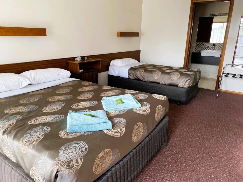 Postel nebo postele na pokoji v ubytování Dalvue Motel