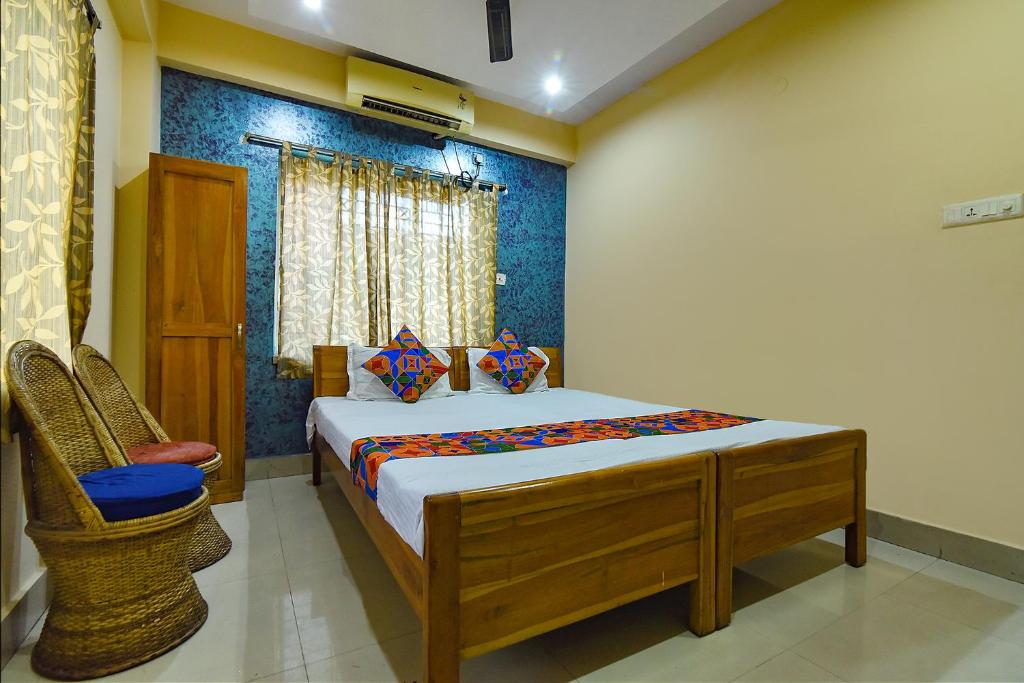 מיטה או מיטות בחדר ב-FabExpress Sai City Inn