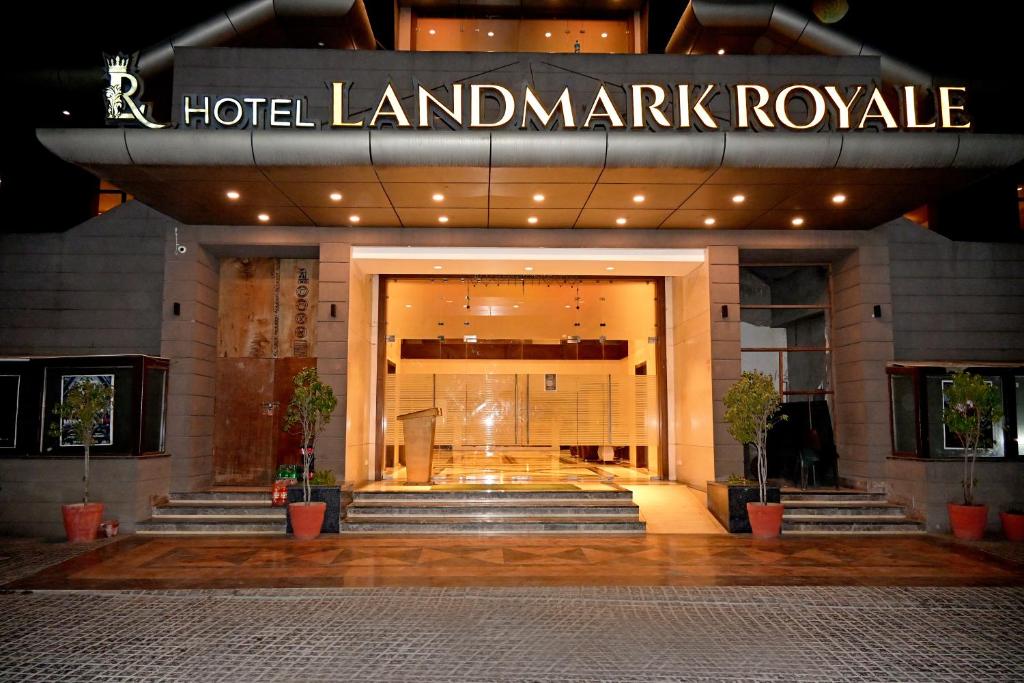 a hotel lobby with a hotel landmark royale sign at HOTEL LANDMARK ROYALE, LAKHIMPUR in Lakhīmpur