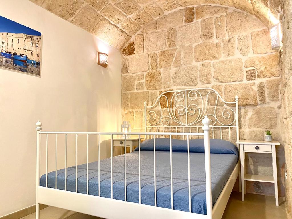 En eller flere senger på et rom på Dimore Aria di Mare - Puglia Mia Apartments