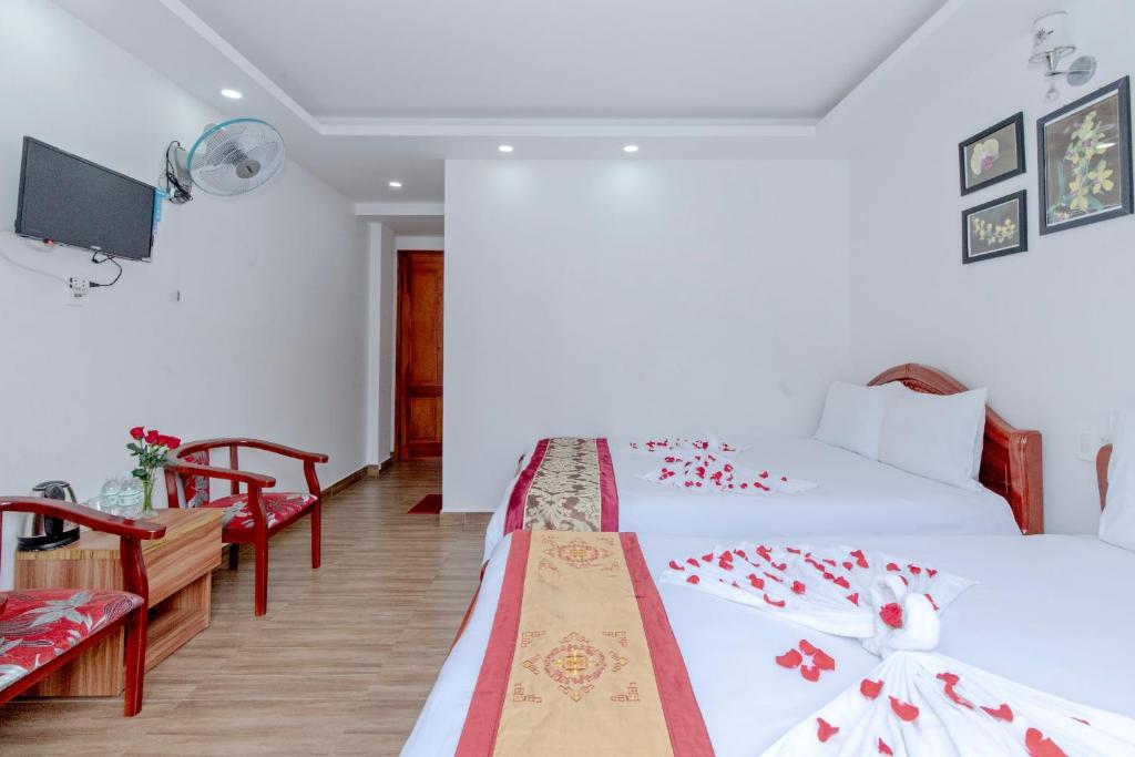 Postel nebo postele na pokoji v ubytování Moc Nhien Hostel Da Lat