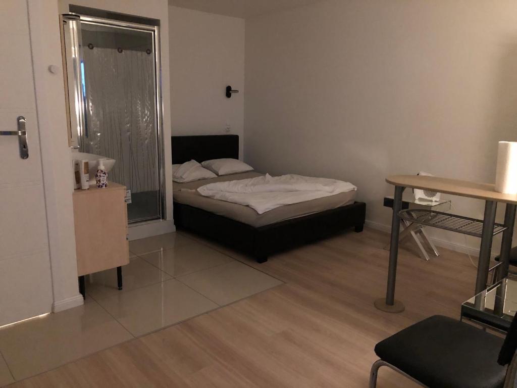 Ένα ή περισσότερα κρεβάτια σε δωμάτιο στο Mini Studio A Bed4U Late Check in