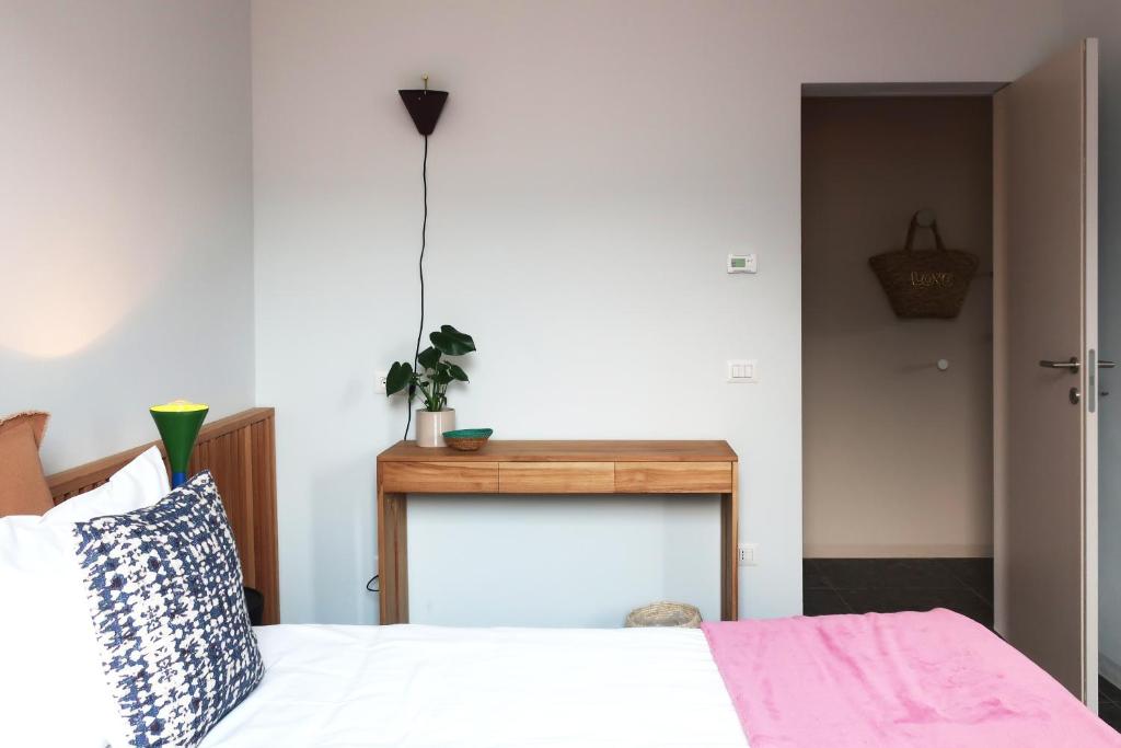 Een bed of bedden in een kamer bij Picobello Lago