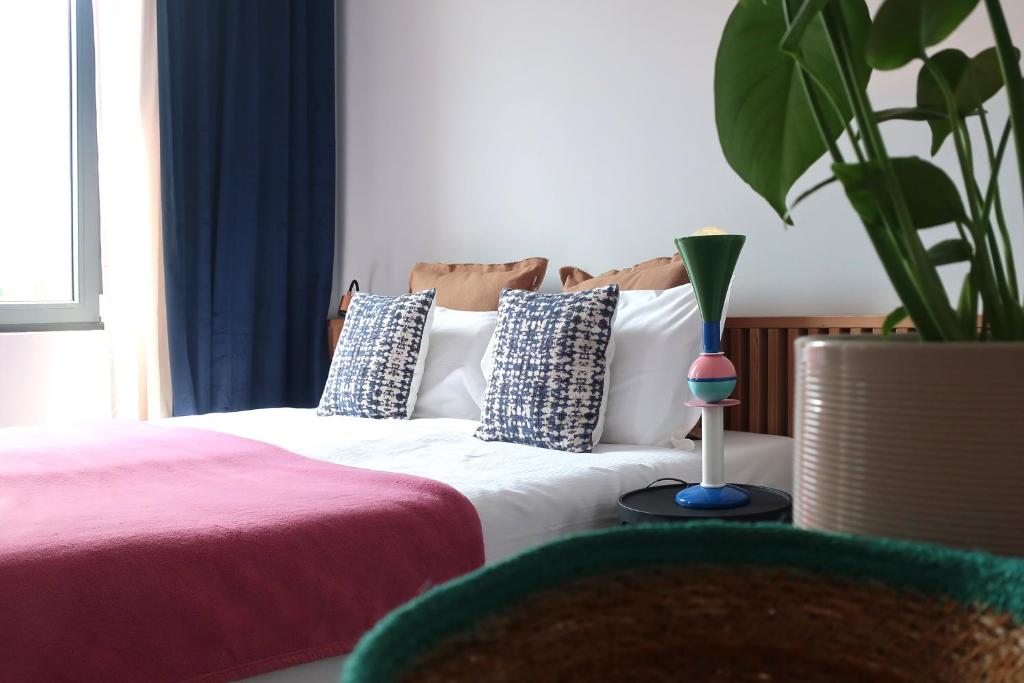 Een bed of bedden in een kamer bij Picobello Lago