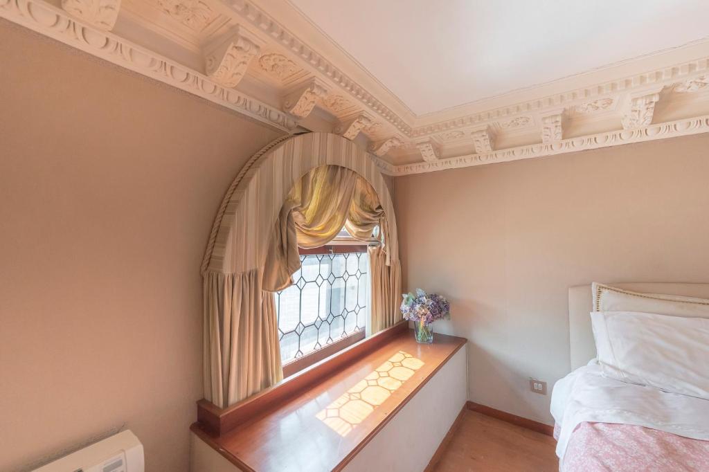 Posteľ alebo postele v izbe v ubytovaní Canal Grande Suite